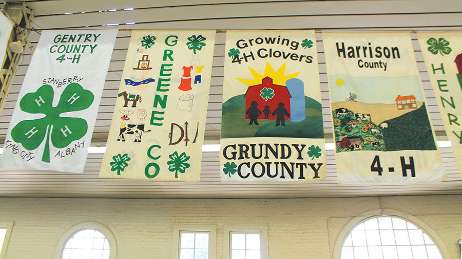 Banners from different county 4-H groups hang in the 4-H building.